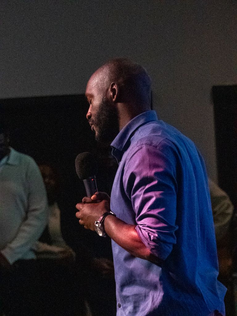 Man at microphone side view