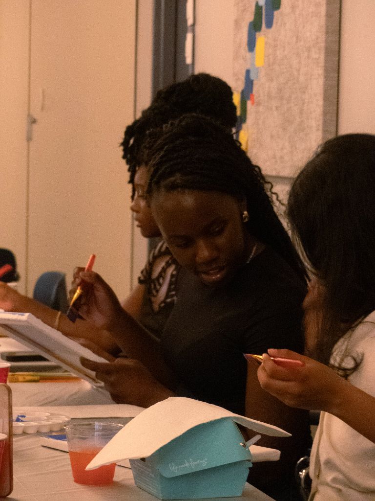 Woman painting at art event