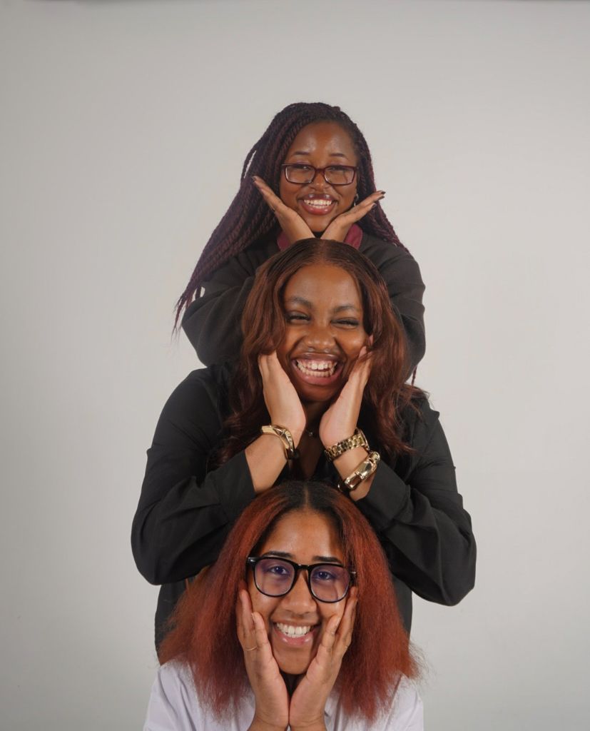 Three women stacked smiling portrait