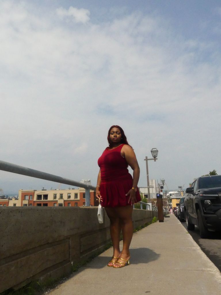 Woman in red dress on boardwalk